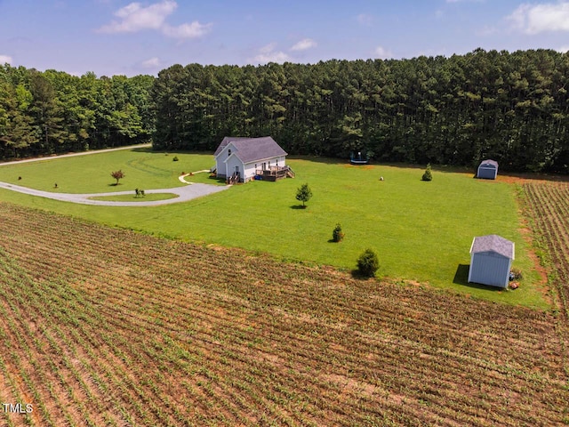 aerial view of property and surrounding area with a forest