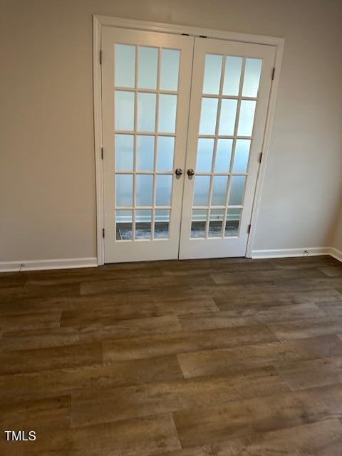 entryway with french doors, baseboards, and wood finished floors