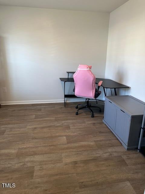 office area with wood finished floors and baseboards