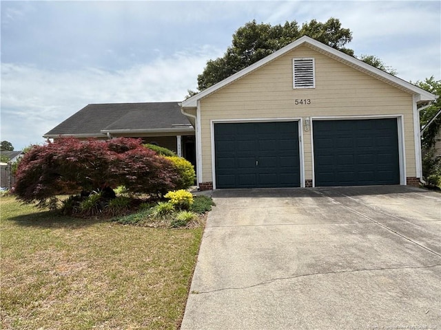 5413 Heather St, Hope Mills, NC 28348 - single story home with driveway, a front yard, and an attached garage