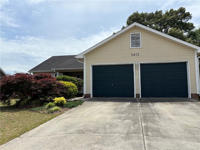 5413 Heather St, Hope Mills, NC 28348 - view of front of home featuring a garage and driveway