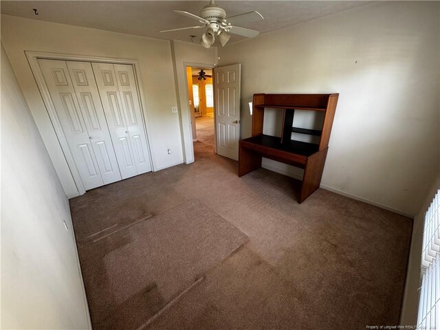 5413 Heather St, Hope Mills, NC 28348 - unfurnished bedroom featuring carpet floors, a closet, baseboards, and a ceiling fan