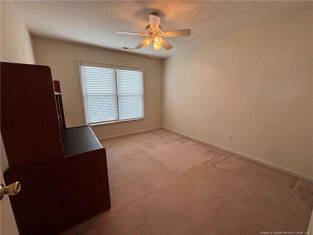 5413 Heather St, Hope Mills, NC 28348 - empty room featuring ceiling fan, light carpet, and baseboards