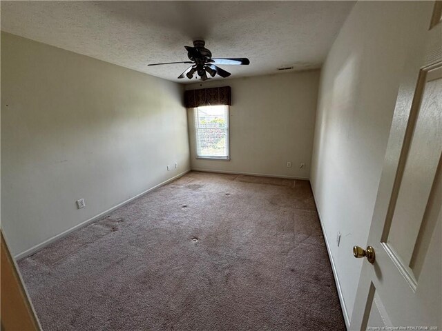5413 Heather St, Hope Mills, NC 28348 - unfurnished room featuring carpet flooring, ceiling fan, a textured ceiling, and baseboards