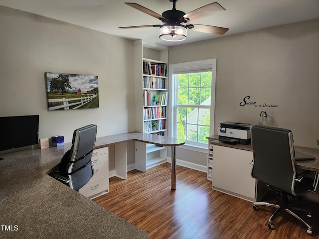 office with a ceiling fan, wood finished floors, and baseboards