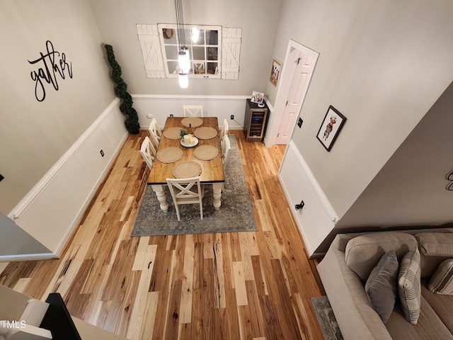 dining space featuring wood finished floors and baseboards