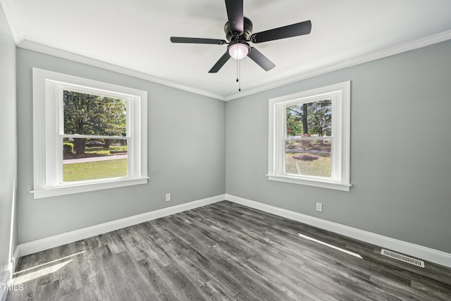 empty room with crown molding, baseboards, wood finished floors, and a ceiling fan