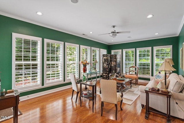 dining area featuring ceiling fan, hardwood / wood-style floors, crown molding, and recessed lighting