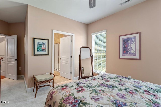 bedroom with light carpet, baseboards, and a ceiling fan