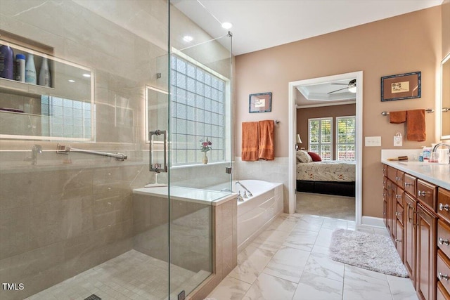 ensuite bathroom with a shower stall, a ceiling fan, a garden tub, vanity, and marble finish floors