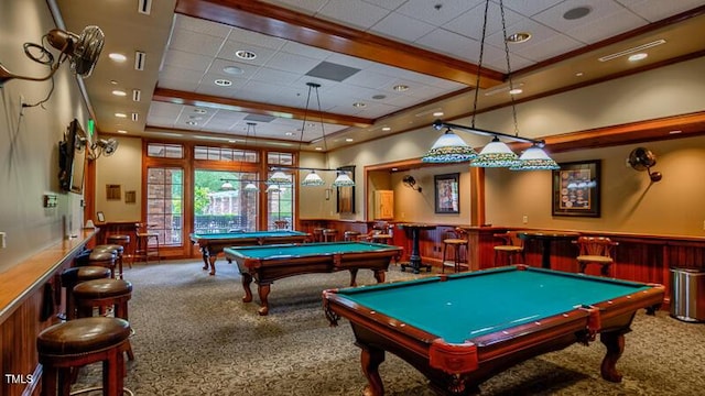 recreation room featuring billiards, carpet, a dry bar, a wainscoted wall, and a tray ceiling