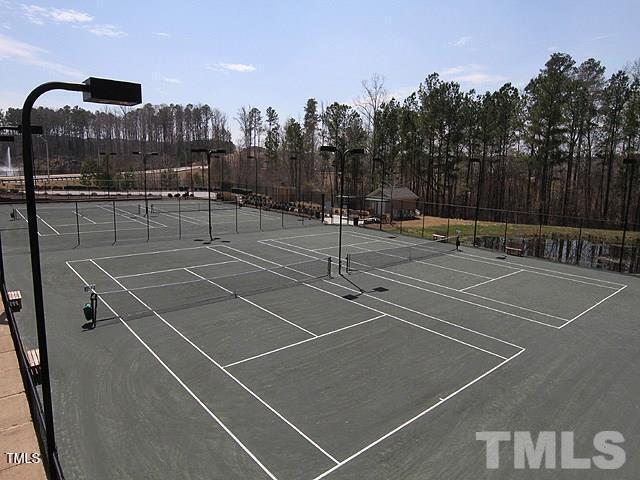 view of tennis court with fence