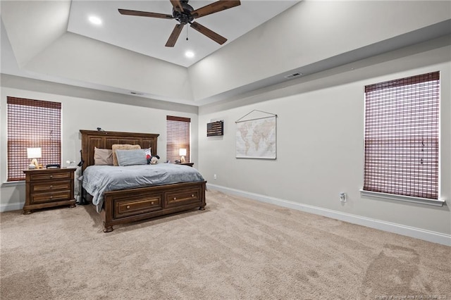 bedroom with baseboards, light colored carpet, recessed lighting, ceiling fan, and high vaulted ceiling