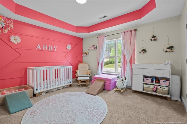 bedroom featuring carpet flooring and a nursery area
