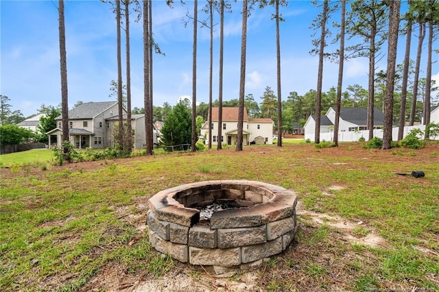 view of yard with an outdoor fire pit