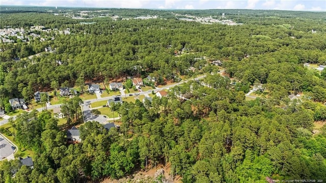 aerial overview of property's location with a forest