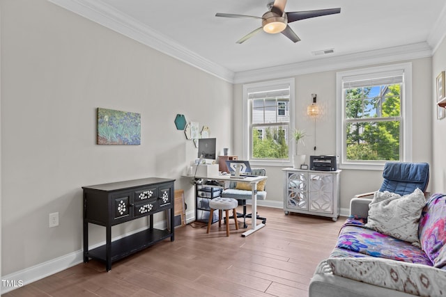 home office featuring a ceiling fan, wood finished floors, ornamental molding, and baseboards