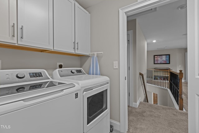 clothes washing area with separate washer and dryer, cabinet space, carpet floors, baseboards, and recessed lighting