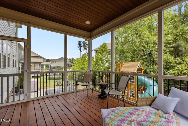 sunroom with a residential view