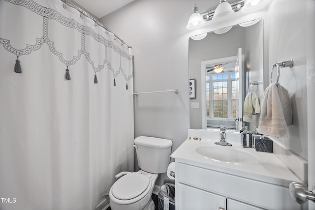 full bathroom with toilet, vanity, ceiling fan, and a shower with shower curtain