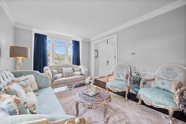 living room featuring crown molding, wood finished floors, and baseboards