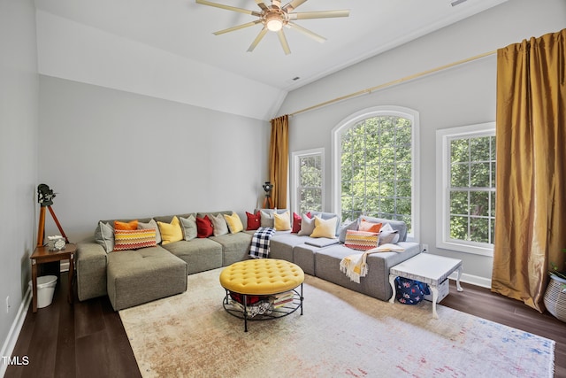 living room featuring wood finished floors, ceiling fan, baseboards, and lofted ceiling