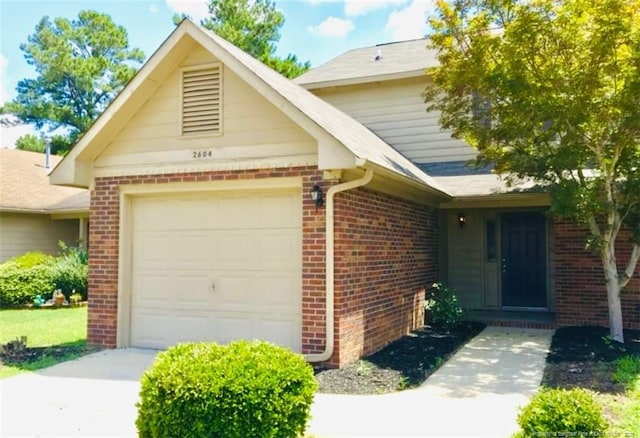 2604 Burke Ln, Fayetteville, NC 28306 - view of front of property featuring brick siding and a garage