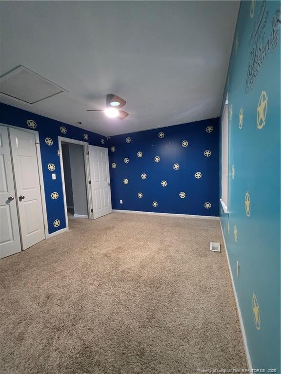 2604 Burke Ln, Fayetteville, NC 28306 - unfurnished bedroom featuring carpet, baseboards, attic access, and a ceiling fan