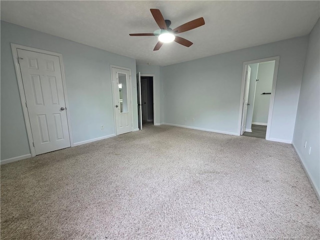 2604 Burke Ln, Fayetteville, NC 28306 - unfurnished bedroom with carpet flooring, baseboards, ensuite bath, and ceiling fan