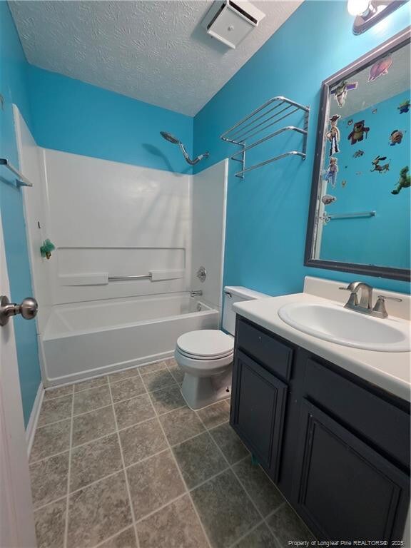 2604 Burke Ln, Fayetteville, NC 28306 - full bathroom with a textured ceiling, vanity, shower / tub combination, and toilet