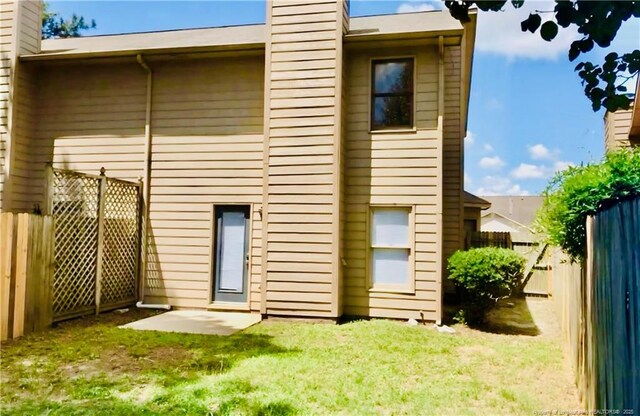 2604 Burke Ln, Fayetteville, NC 28306 - rear view of house with a chimney