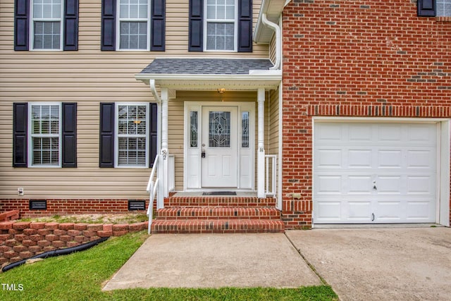 view of exterior entry featuring driveway