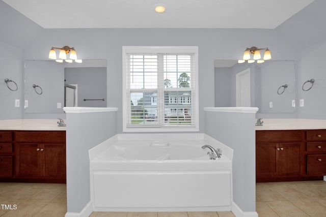 bathroom with tile patterned flooring, a garden tub, two vanities, and walk in shower