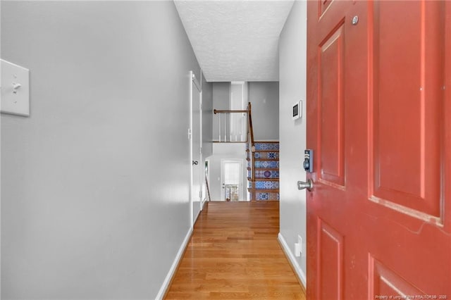4725 Grandison Ct, Hope Mills, NC 28348 - hall with baseboards, light wood finished floors, and a textured ceiling