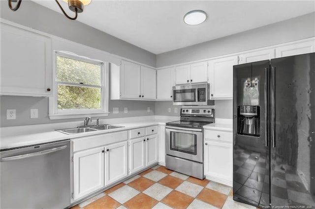 4725 Grandison Ct, Hope Mills, NC 28348 - kitchen with stainless steel appliances, a sink, light countertops, and white cabinets
