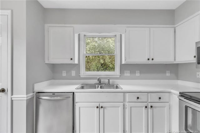 4725 Grandison Ct, Hope Mills, NC 28348 - kitchen with appliances with stainless steel finishes, a sink, white cabinets, and light countertops