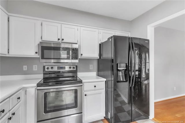 4725 Grandison Ct, Hope Mills, NC 28348 - kitchen featuring stainless steel appliances, white cabinetry, and light countertops