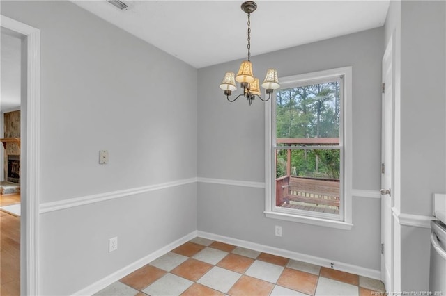 4725 Grandison Ct, Hope Mills, NC 28348 - unfurnished dining area with a chandelier and baseboards
