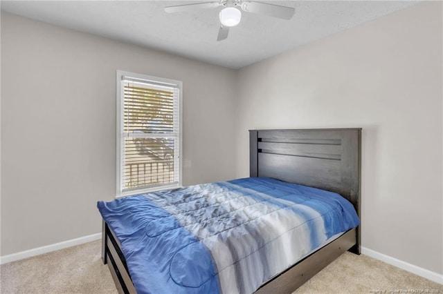4725 Grandison Ct, Hope Mills, NC 28348 - carpeted bedroom featuring baseboards, a textured ceiling, and a ceiling fan