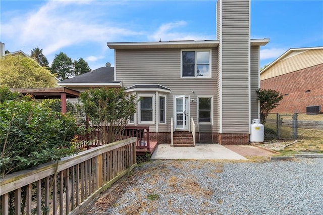 4725 Grandison Ct, Hope Mills, NC 28348 - rear view of property featuring a chimney, fence, entry steps, central AC unit, and a patio