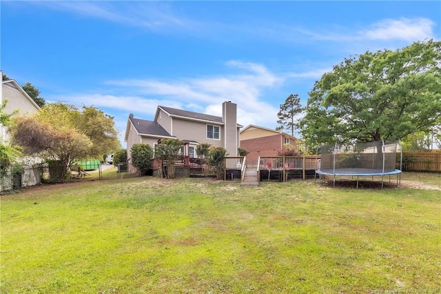 4725 Grandison Ct, Hope Mills, NC 28348 - back of house featuring a wooden deck, a trampoline, and a chimney