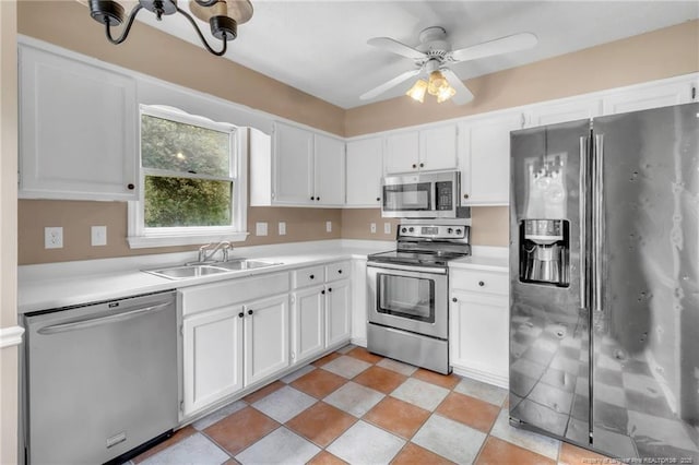 4725 Grandison Ct, Hope Mills, NC 28348 - kitchen with stainless steel appliances, a sink, white cabinetry, and light countertops