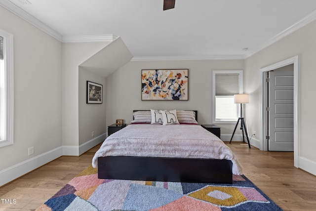 bedroom with ornamental molding, wood finished floors, baseboards, and a ceiling fan