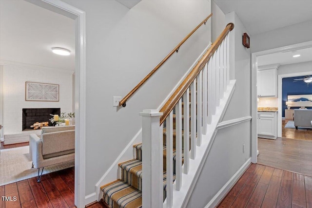3418 Carriage Trl, Hillsborough, NC 27278 - stairs featuring wood-type flooring and a brick fireplace