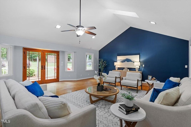 3418 Carriage Trl, Hillsborough, NC 27278 - living area with wood finished floors, french doors, lofted ceiling, healthy amount of natural light, and ceiling fan