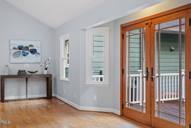 3418 Carriage Trl, Hillsborough, NC 27278 - doorway to outside featuring french doors, lofted ceiling, baseboards, and wood finished floors