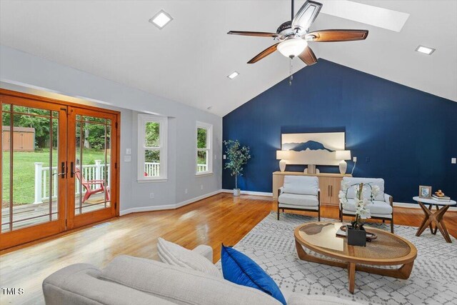 3418 Carriage Trl, Hillsborough, NC 27278 - living area with wood finished floors, lofted ceiling, ceiling fan, baseboards, and french doors