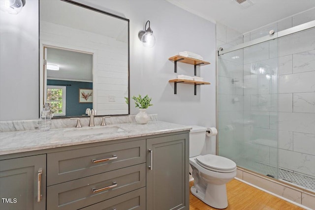 3418 Carriage Trl, Hillsborough, NC 27278 - bathroom with wood finished floors, a stall shower, toilet, and vanity