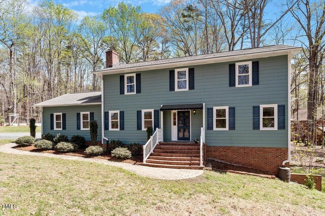 3418 Carriage Trl, Hillsborough, NC 27278 - colonial house with a chimney and a front yard