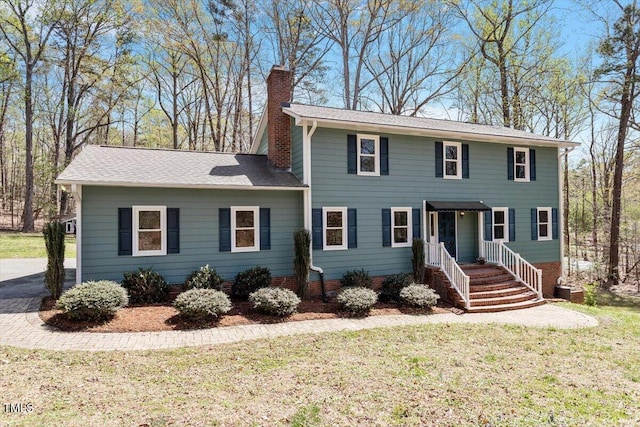 3418 Carriage Trl, Hillsborough, NC 27278 - colonial home featuring a chimney and a front lawn